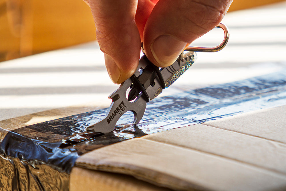 TRUE Sharkey multi-tool nail cleaner and box cutter function close-up