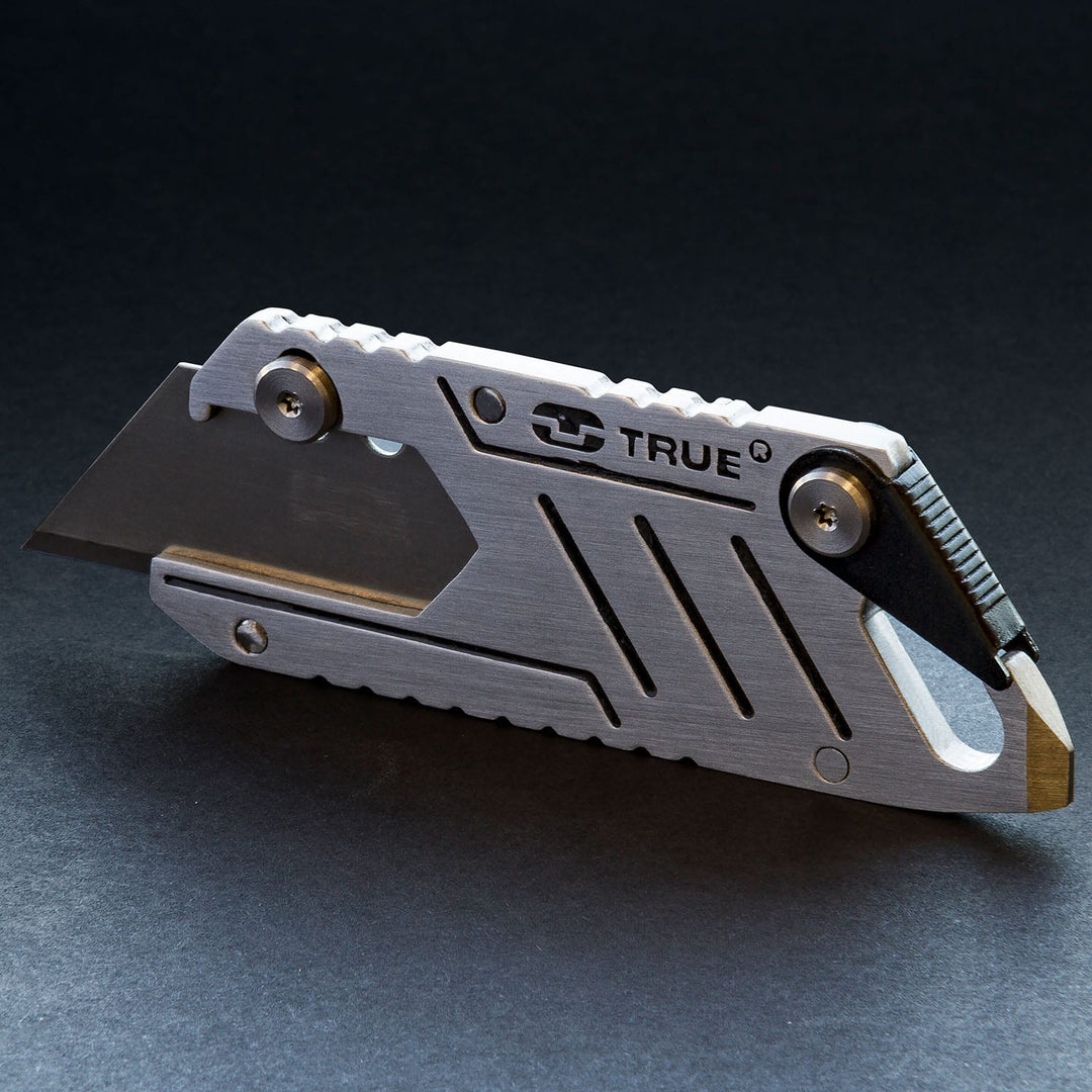True Utility simply means ‘Really Useful’. Our collection of pocket tools are all about making sure you’re ready for whatever, while still being able to live light. Boxcutter securely holds one standard utility blade within its slimline frame. The integrated sprung blade lock button holds the blade safely in place when in use; the blade can be easily replaced when needed. Doubles as a bottle opener and a flat head screwdriver