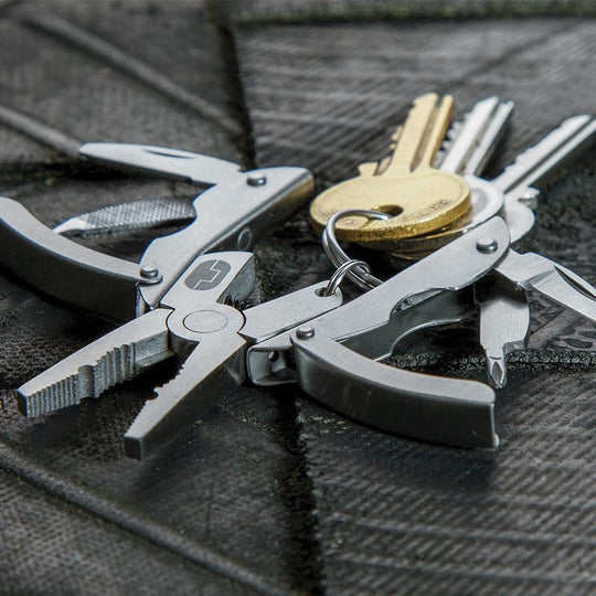 True Utility Scarab 7 in one multi tool. The functions of this tool includes: Pliers / Wire Cutters / Knife / Flat Screwdriver / Phillips Screwdriver / Nail File / Finger Nail Cleaner